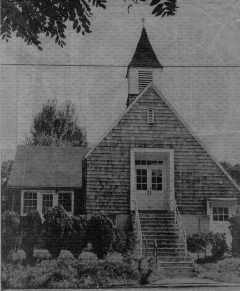 A black and white photo of an old church.