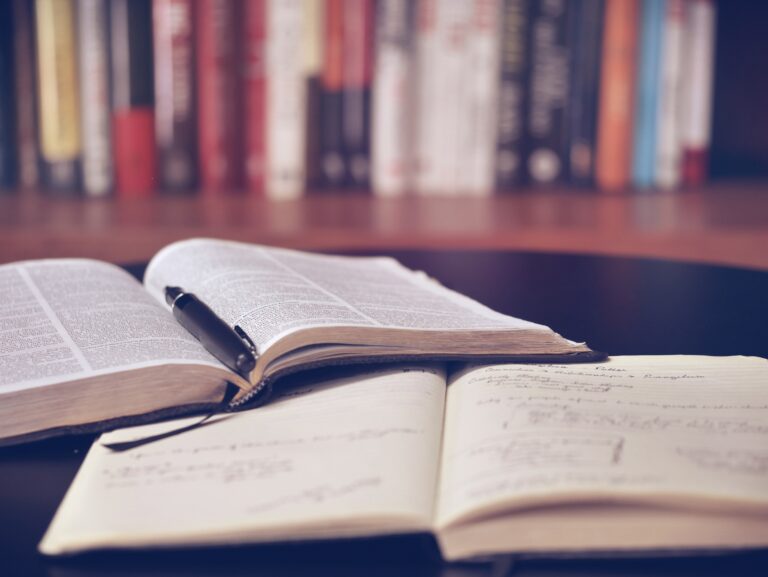 A table with some books and papers on it